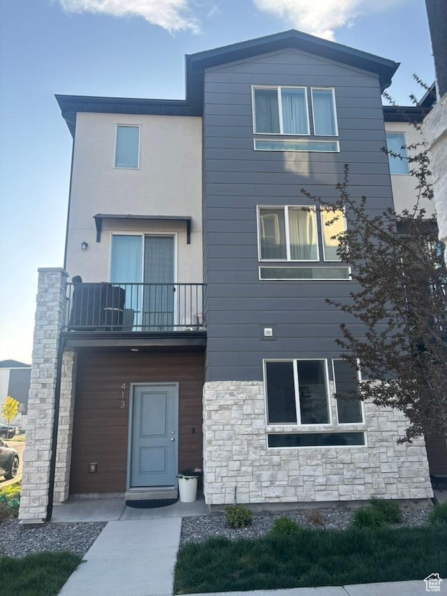 413 S 980 W, American Fork, UT 84003 - exterior space featuring stone siding and a balcony