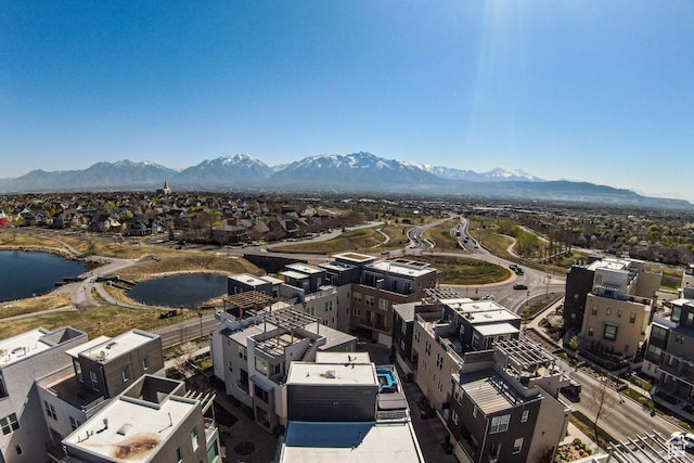 birds eye view of property featuring a water and mountain view and a residential view