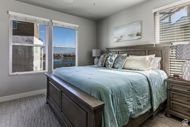 carpeted bedroom with baseboards
