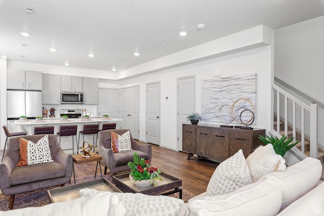 947 N Riverside Dr Unit 977, Saratoga Springs, UT 84045 - living room with recessed lighting, stairs, and dark wood finished floors