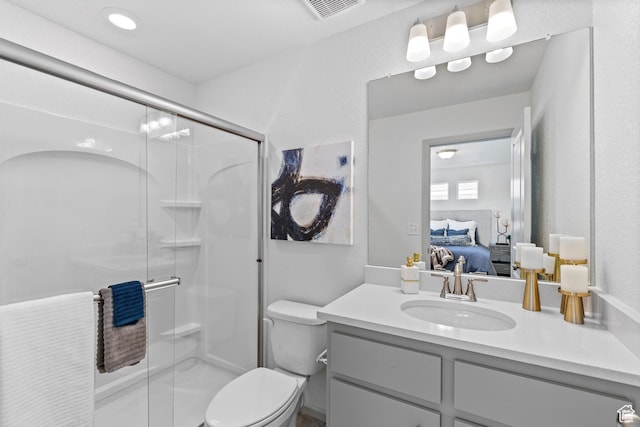 947 N Riverside Dr Unit 977, Saratoga Springs, UT 84045 - bathroom with a shower stall, ensuite bathroom, vanity, toilet, and visible vents