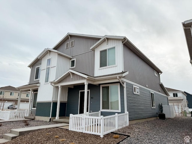 view of front facade with a porch and central AC unit