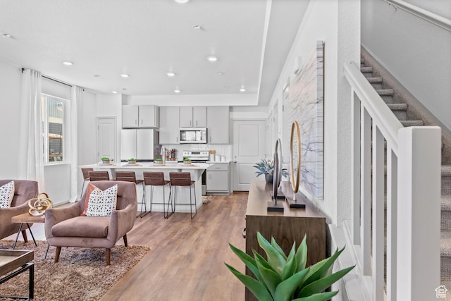 947 N Riverside Dr Unit 977, Saratoga Springs, UT 84045 - living room featuring recessed lighting and light wood-style flooring