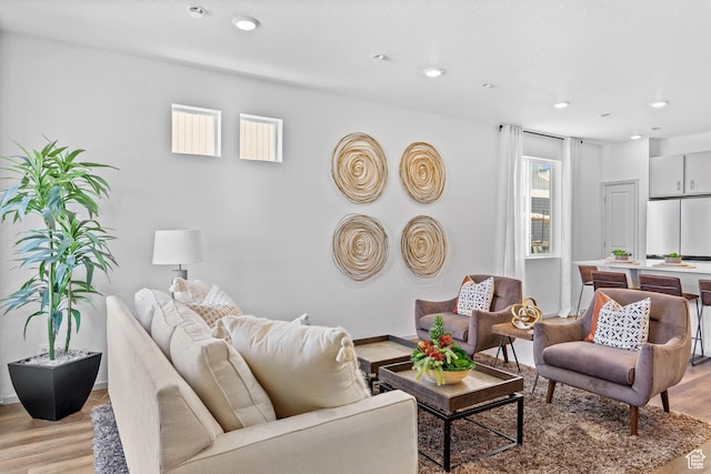 947 N Riverside Dr Unit 977, Saratoga Springs, UT 84045 - living room featuring baseboards, recessed lighting, and light wood-style floors