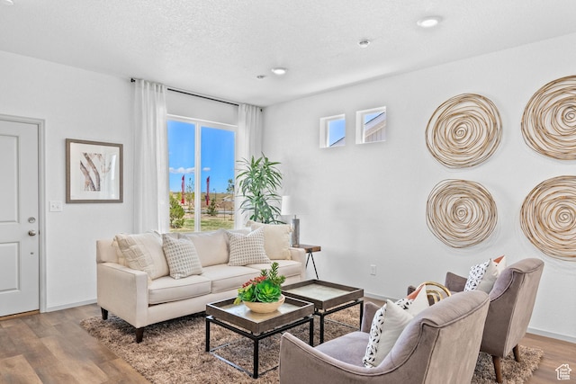947 N Riverside Dr Unit 977, Saratoga Springs, UT 84045 - living room with baseboards, wood finished floors, a textured ceiling, and recessed lighting