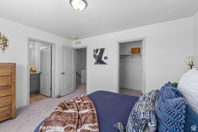947 N Riverside Dr Unit 977, Saratoga Springs, UT 84045 - bedroom with carpet floors, ensuite bathroom, visible vents, and a closet