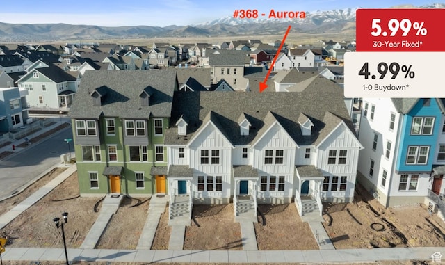 aerial view of residential area featuring a mountain backdrop