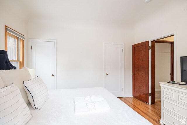 79 E Hillside Ave, Salt Lake City, UT 84103 - bedroom featuring multiple closets and light wood-style floors