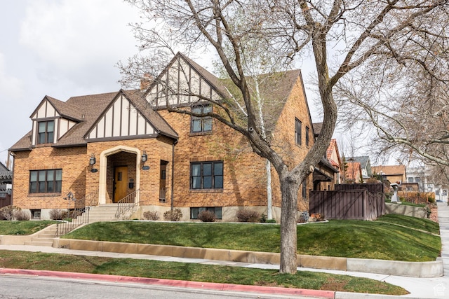 79 E Hillside Ave, Salt Lake City, UT 84103 - tudor home with brick siding and a front yard