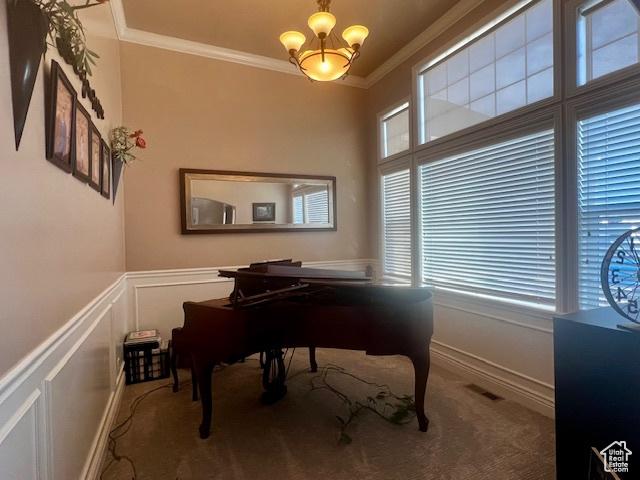 164 Park Ridge Dr, Roosevelt, UT 84066 - interior space with a wainscoted wall, a chandelier, a decorative wall, and crown molding