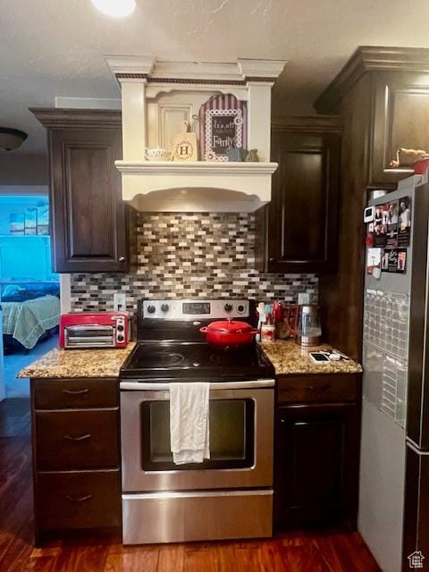 164 Park Ridge Dr, Roosevelt, UT 84066 - kitchen featuring dark brown cabinets, stainless steel appliances, and decorative backsplash