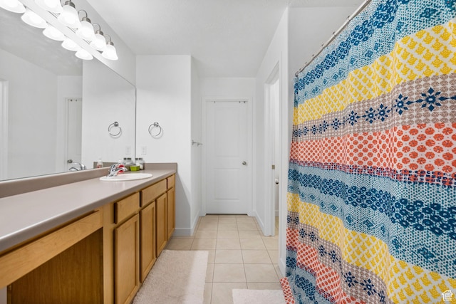 full bathroom featuring vanity, tile patterned flooring, and a shower with curtain