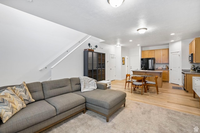 living room featuring recessed lighting and light wood-style flooring