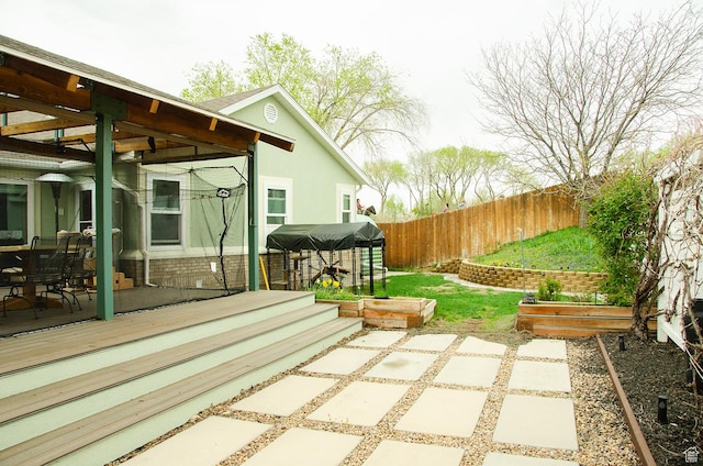 1849 E Gracey Ln S, Sandy, UT 84092 - view of patio featuring a wooden deck and a fenced backyard