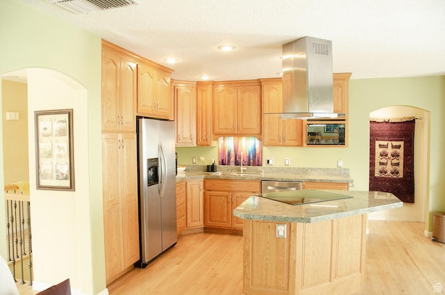 1849 E Gracey Ln S, Sandy, UT 84092 - kitchen featuring arched walkways, light brown cabinets, appliances with stainless steel finishes, and island range hood