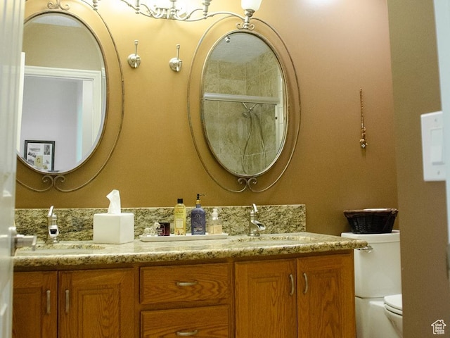 1849 E Gracey Ln S, Sandy, UT 84092 - full bathroom featuring double vanity, toilet, and a sink