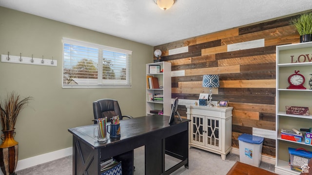 carpeted office with wooden walls and baseboards