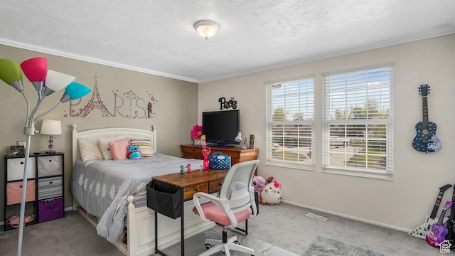 carpeted bedroom with baseboards, crown molding, and visible vents