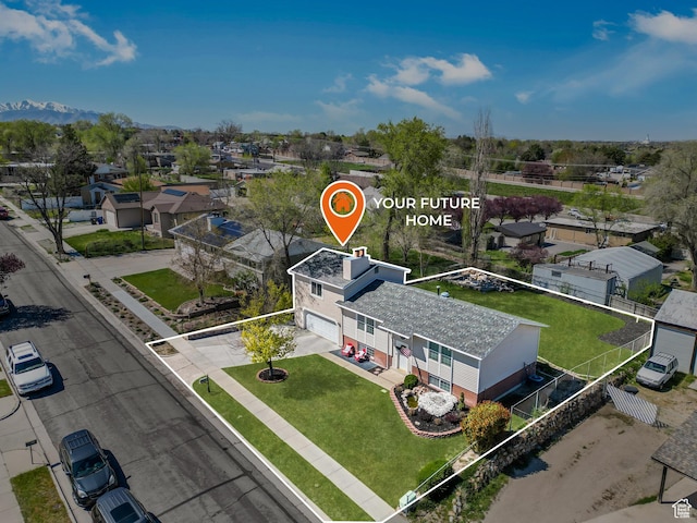 drone / aerial view featuring a mountain view and a residential view