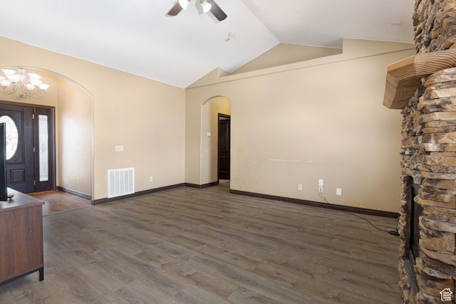 5095 N Ridgeview Cir, Enoch, UT 84721 - unfurnished living room featuring arched walkways, vaulted ceiling, visible vents, ceiling fan with notable chandelier, and wood finished floors