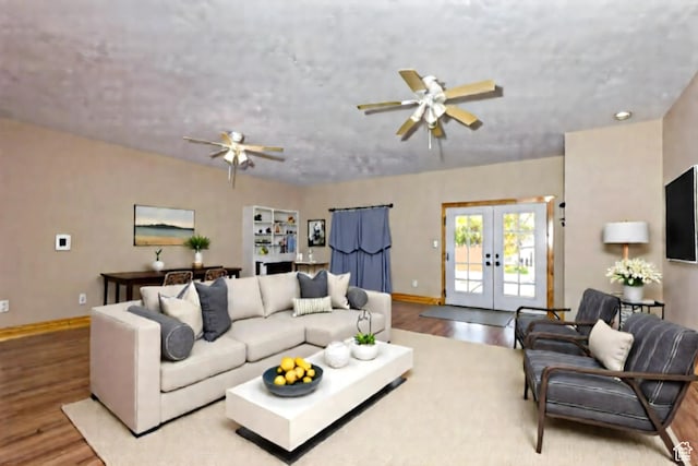 5095 N Ridgeview Cir, Enoch, UT 84721 - living area with wood finished floors, a ceiling fan, baseboards, and french doors
