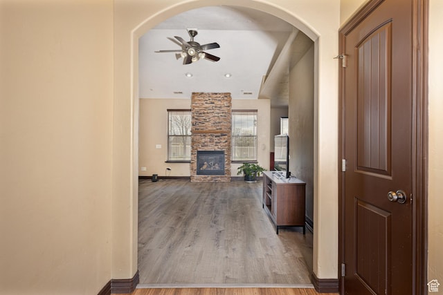 5095 N Ridgeview Cir, Enoch, UT 84721 - hall featuring baseboards, wood finished floors, and arched walkways