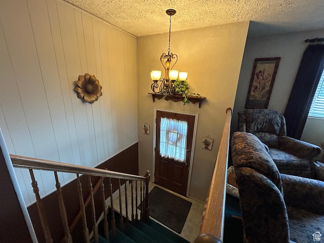 3748 W 5140 S, Taylorsville, UT 84129 - foyer entrance with a textured ceiling and a notable chandelier