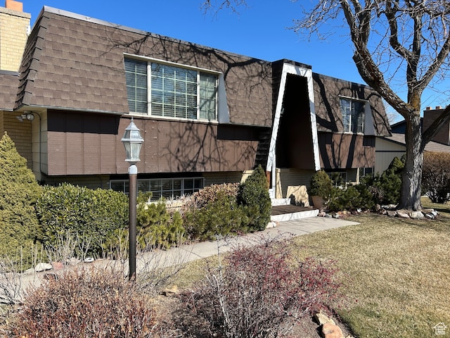 3748 W 5140 S, Taylorsville, UT 84129 - view of front facade featuring a chimney, mansard roof, and a shingled roof