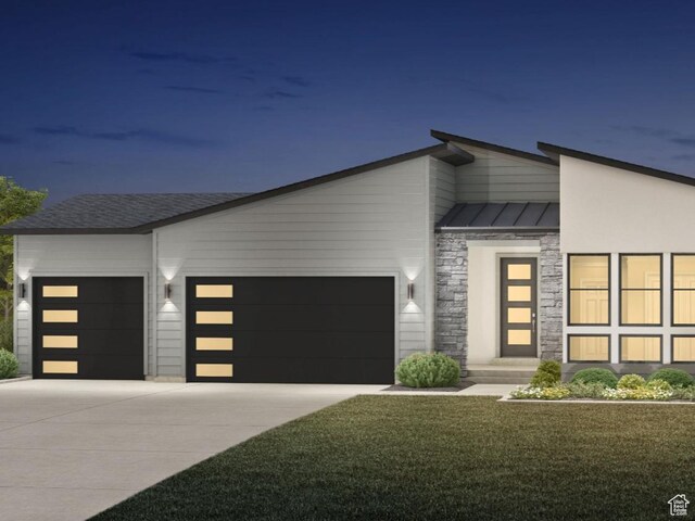 1142 W Gossamer Ln Unit 9, Saratoga Springs, UT 84045 - contemporary house featuring a standing seam roof, metal roof, concrete driveway, an attached garage, and stone siding