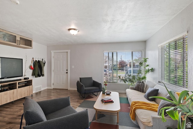 922 N Colorado St, Salt Lake City, UT 84116 - living room featuring baseboards, visible vents, a textured ceiling, and dark wood-style floors