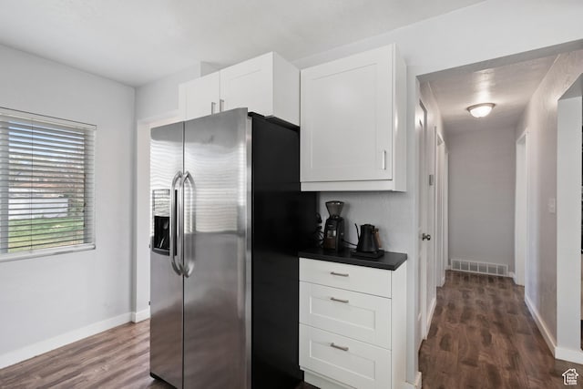 922 N Colorado St, Salt Lake City, UT 84116 - kitchen featuring dark wood finished floors, dark countertops, visible vents, white cabinetry, and stainless steel fridge with ice dispenser