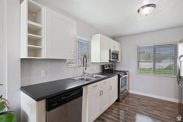 922 N Colorado St, Salt Lake City, UT 84116 - kitchen with a wealth of natural light, dark countertops, stainless steel appliances, and a sink