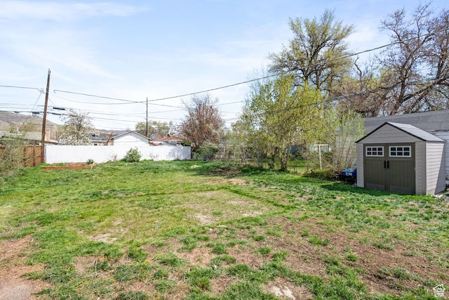 922 N Colorado St, Salt Lake City, UT 84116 - view of yard with a storage unit, an outbuilding, and fence