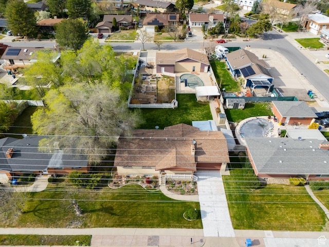 birds eye view of property with a residential view