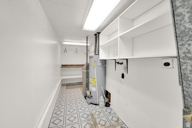 utility room with gas water heater