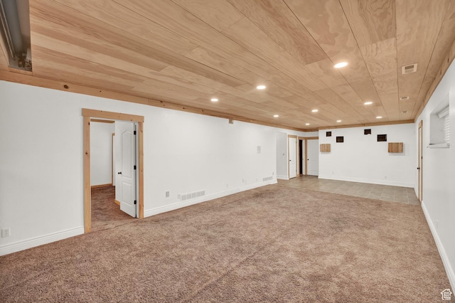 spare room featuring recessed lighting, visible vents, carpet flooring, and baseboards