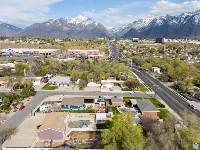 birds eye view of property with a mountain view