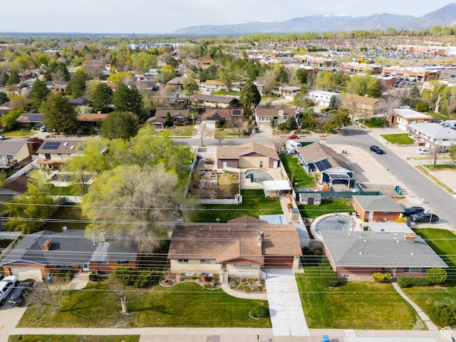 drone / aerial view with a residential view and a mountain view