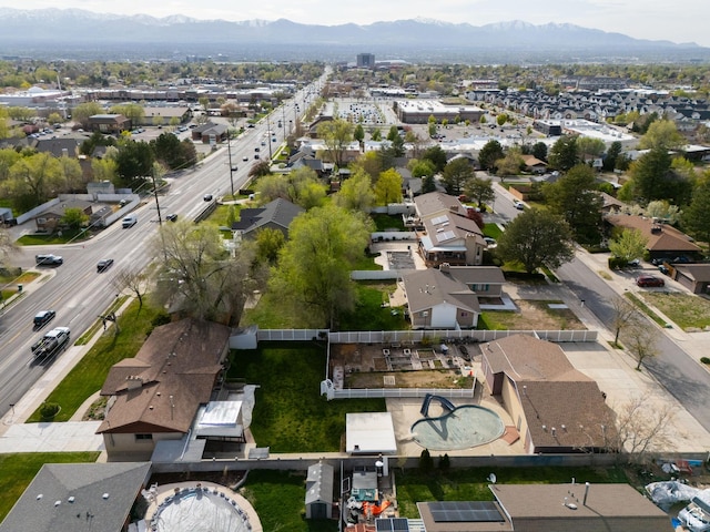 drone / aerial view featuring a residential view and a mountain view