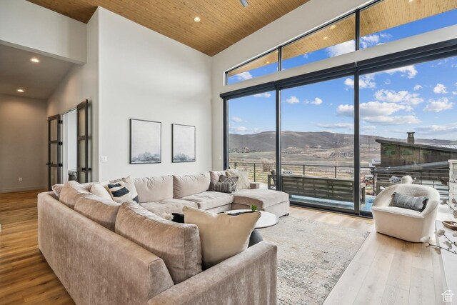 11431 N Ursa Cir Unit 56, Heber City, UT 84032 - living room featuring recessed lighting, a mountain view, high vaulted ceiling, and wood finished floors