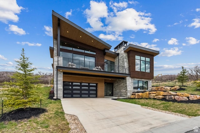11431 N Ursa Cir Unit 56, Heber City, UT 84032 - contemporary house featuring stone siding, concrete driveway, a balcony, and a garage