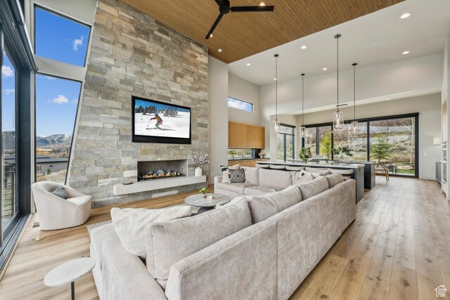 11431 N Ursa Cir Unit 56, Heber City, UT 84032 - living room with recessed lighting, a high ceiling, a healthy amount of sunlight, and light wood-type flooring
