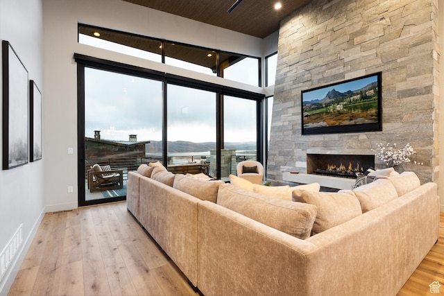 11431 N Ursa Cir Unit 56, Heber City, UT 84032 - living room with a wealth of natural light, visible vents, a fireplace, and light wood-style floors