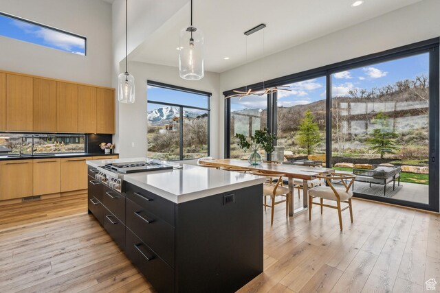 11431 N Ursa Cir Unit 56, Heber City, UT 84032 - kitchen with stainless steel gas cooktop, light wood-style flooring, a sink, a mountain view, and modern cabinets