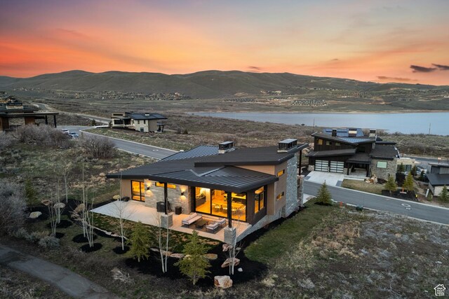 11431 N Ursa Cir Unit 56, Heber City, UT 84032 - rear view of house featuring a standing seam roof, a water and mountain view, and metal roof