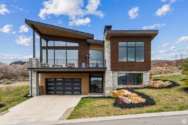 11431 N Ursa Cir Unit 56, Heber City, UT 84032 - contemporary home with driveway, stone siding, a balcony, and a garage