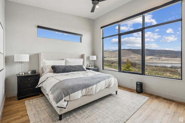 11431 N Ursa Cir Unit 56, Heber City, UT 84032 - bedroom featuring light wood-type flooring, baseboards, and visible vents