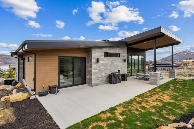 11431 N Ursa Cir Unit 56, Heber City, UT 84032 - back of property with a patio area and a mountain view