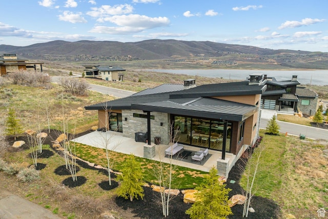 11431 N Ursa Cir Unit 56, Heber City, UT 84032 - rear view of house with fence, a mountain view, a patio, metal roof, and a standing seam roof