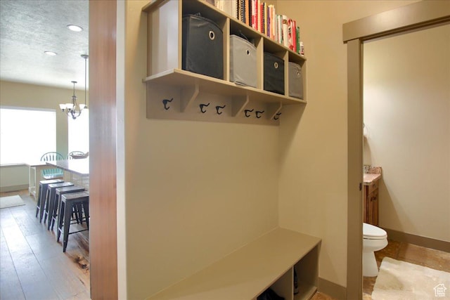 2630 E Riley Dr N, Eagle Mountain, UT 84005 - mudroom with baseboards, an inviting chandelier, and recessed lighting